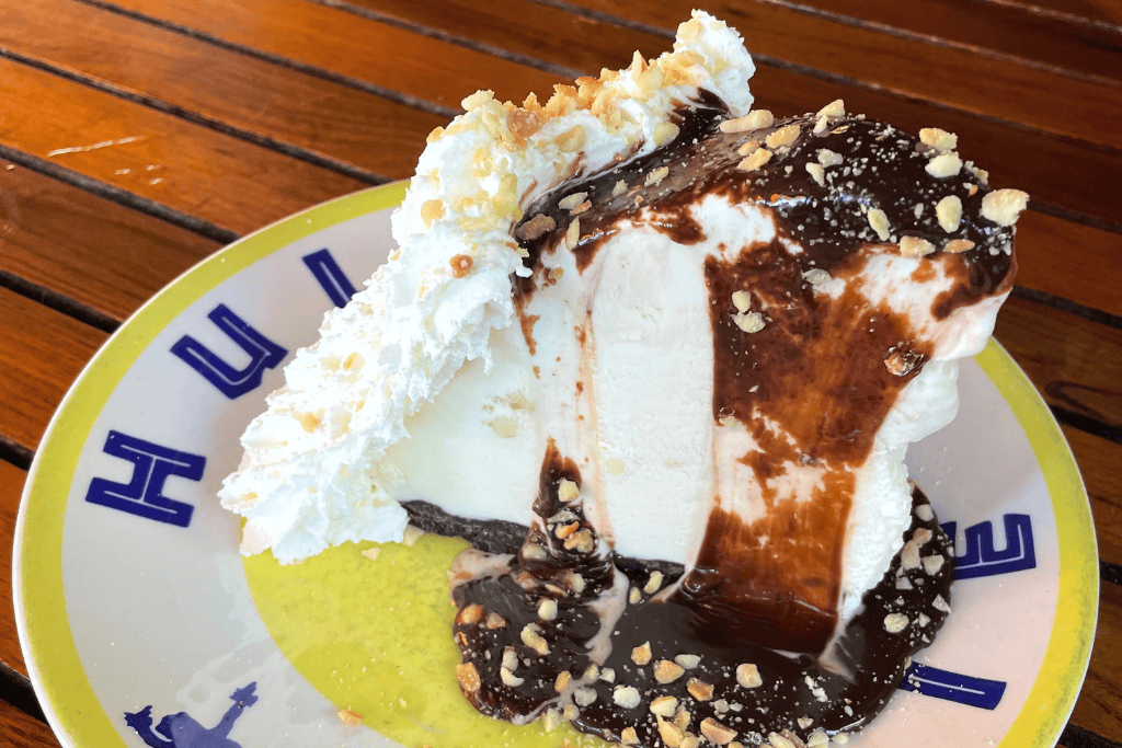 a decadent slice of their famous Hula Pie — piled high with macadamia nut ice cream, hot fudge, and whipped cream.