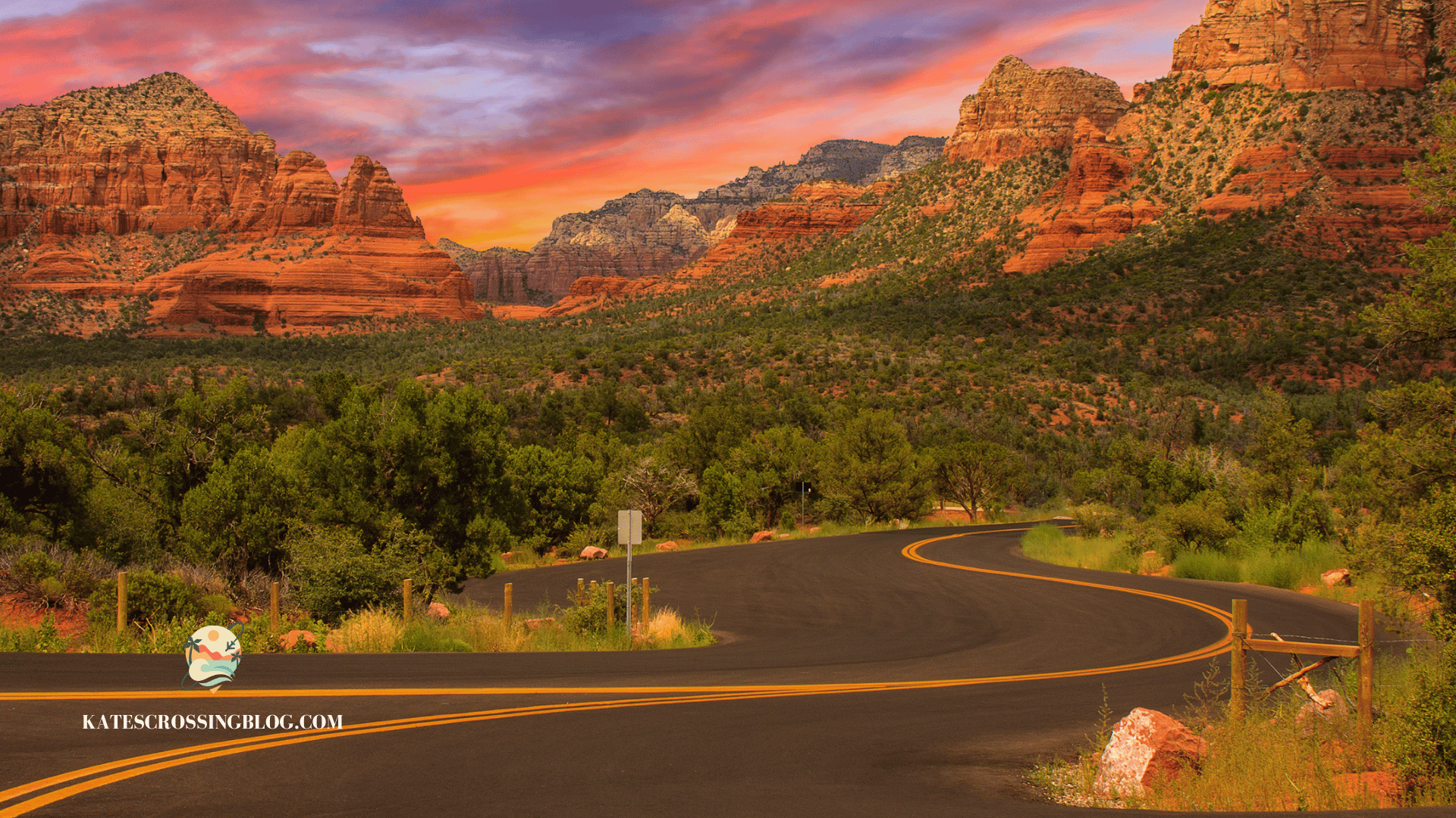 A scenic view of Sedona's iconic red rock formations at sunset, with a winding road leading through the desert landscape.