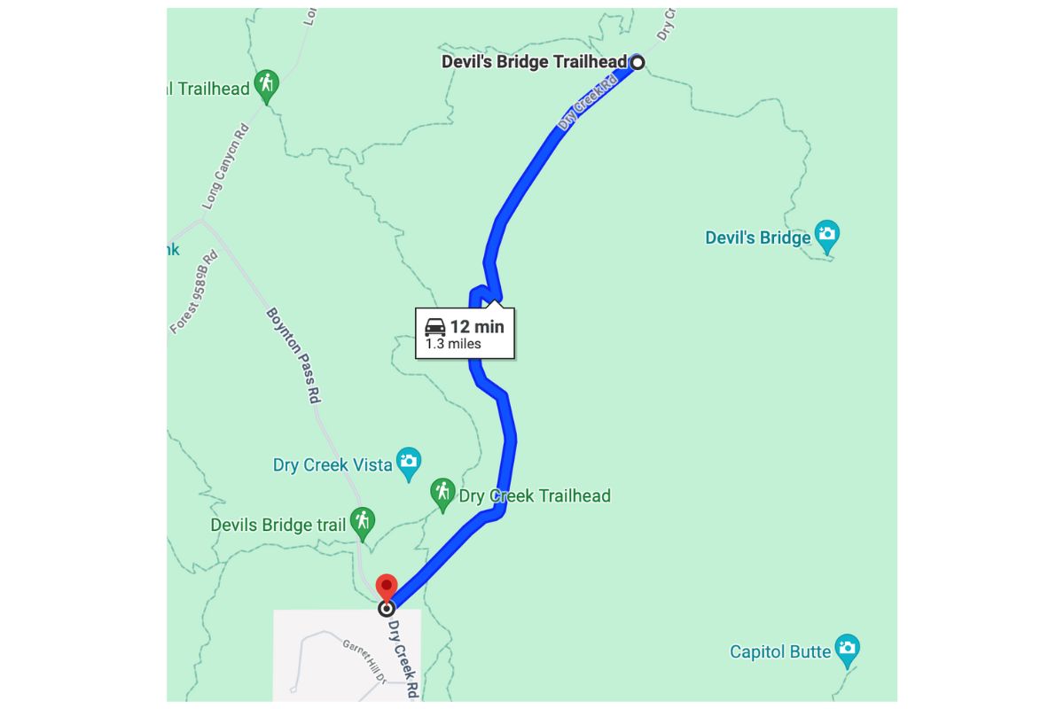 A map showing the driving route from Dry Creek Road to the Devil's Bridge Trailhead, highlighting a 12-minute drive covering 1.3 miles in Sedona, Arizona.