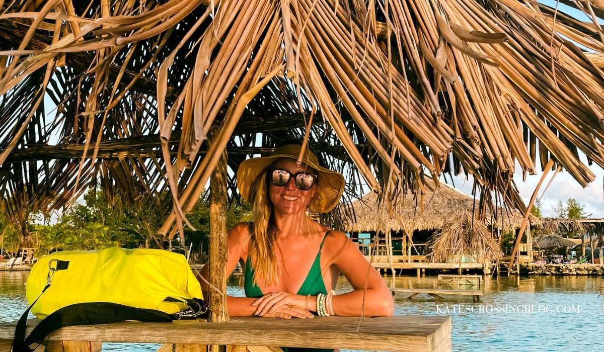 Picture of me sitting at a cabana out in the water with all my belongings safe in a dry bag backpack.