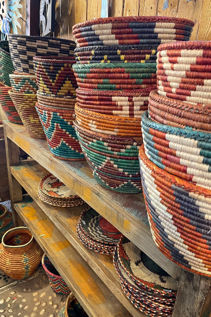 A stack of colorful wicker baskets on a shelf in a shop in Sedona.