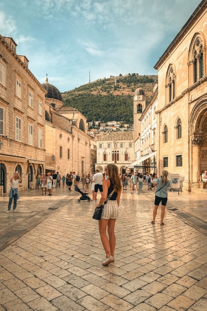 Kate walking the polished cobble stone streets of Dubrovnik on a guided walking tour.
