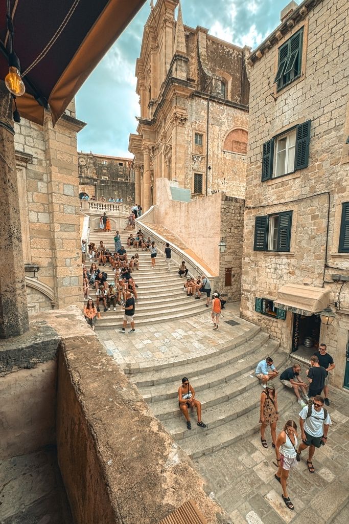Tourists climbing the famous Jesuit Stairs in Dubrovinik. One of the most famous filming locations for Game of Thrones.