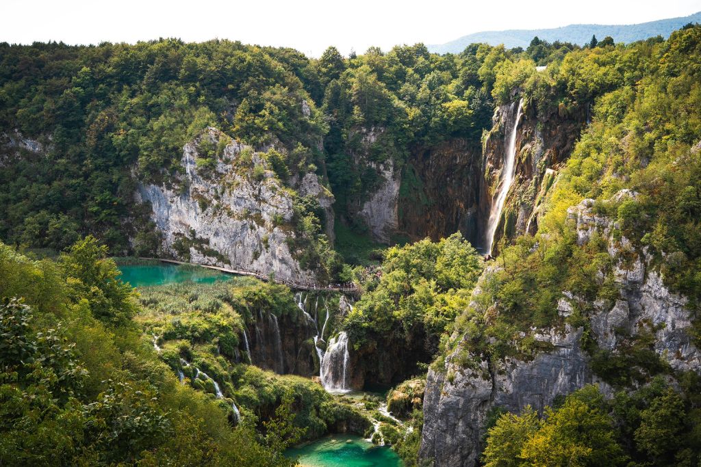 Lush waterfalls and green pools of water in Plitvice Lakes National Park in Croatia.