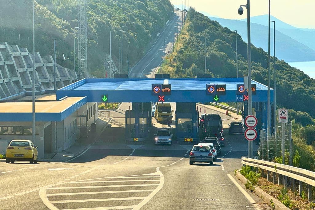 Crossing the border from Croatia into Montenegro during a scenic coastal road trip along the Adriatic coastline.