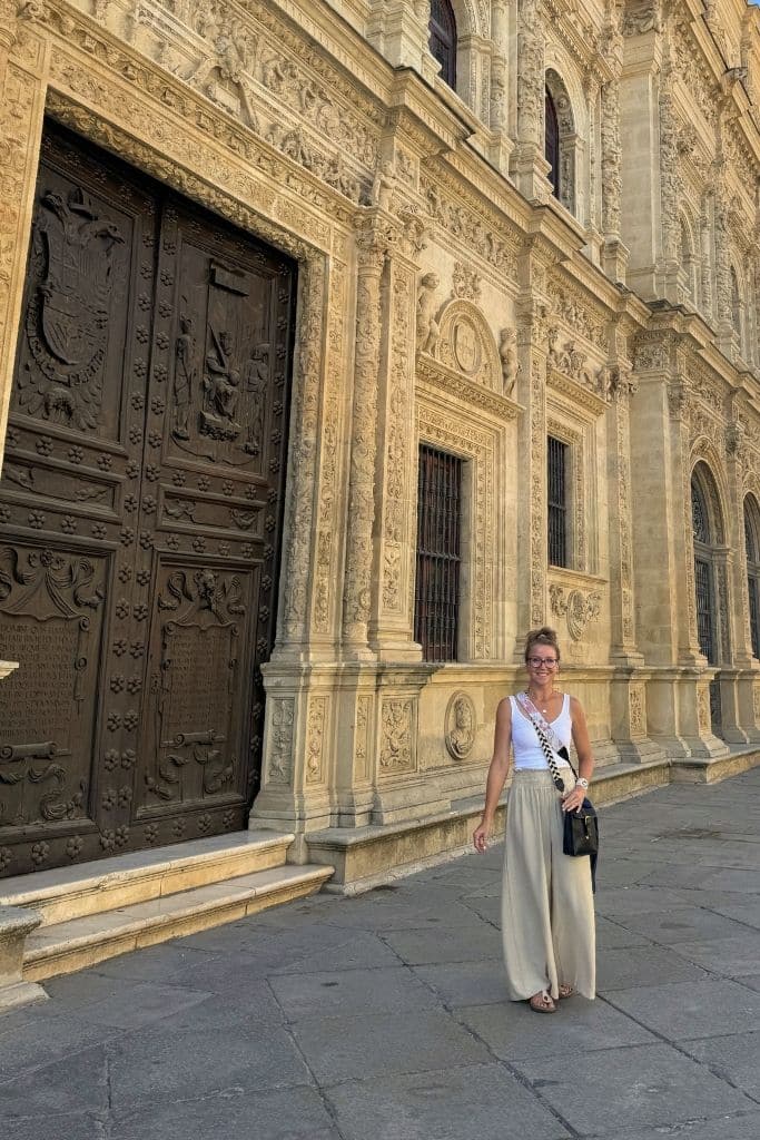 Kate explores Europe in summer wearing lightweight linen pants, comfortable sandals, and a simple sleeveless top.
