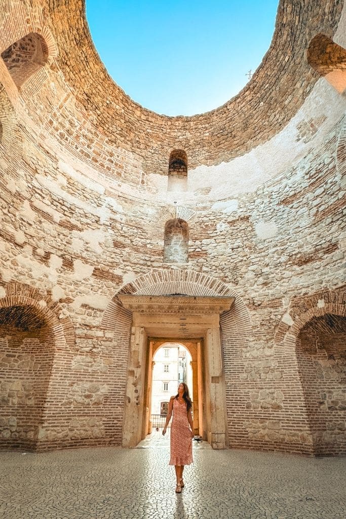 Kate walking beneath the ruins of Diocletian's Palace in Split all by herself at sunrise.