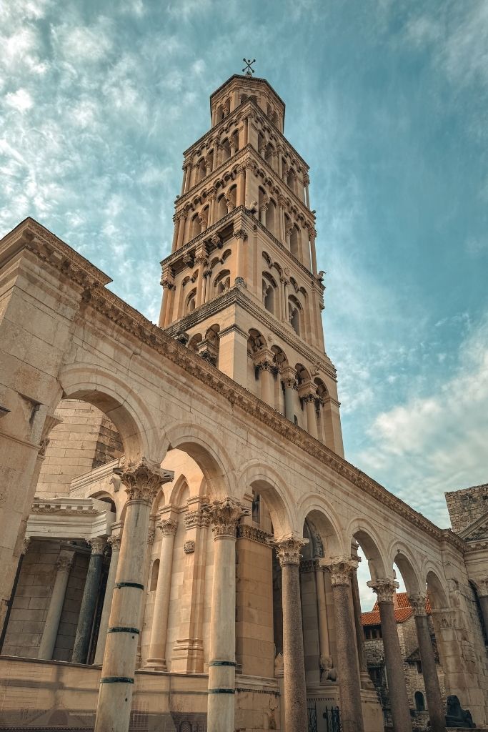 The Bell Tower of Saint Domnius rises above the colonnaded courtyard of Diocletian's Palace, showcasing Romanesque architecture and one of Split's most recognizable landmarks.