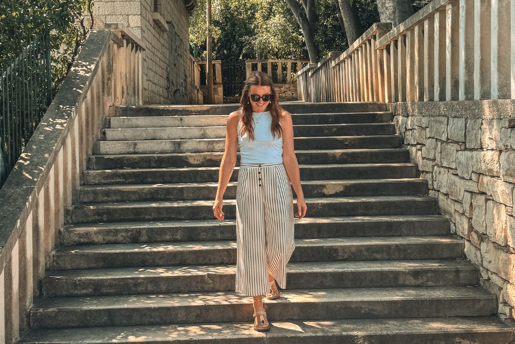 Kate walks down the stone staircase leading up Marjan Hill, making her way toward one of the most popular viewpoints overlooking Split.