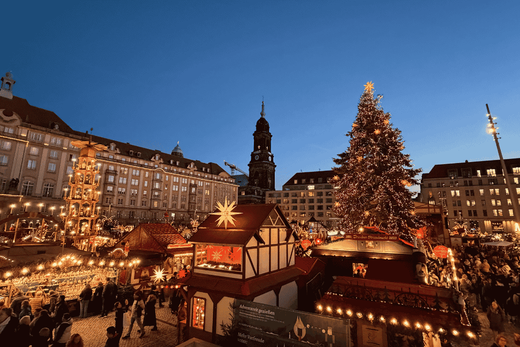 Dresden’s Striezelmarkt glows after dark, with its towering Christmas tree, traditional wooden stalls, and festive lights creating one of Germany’s most magical Christmas market scenes.