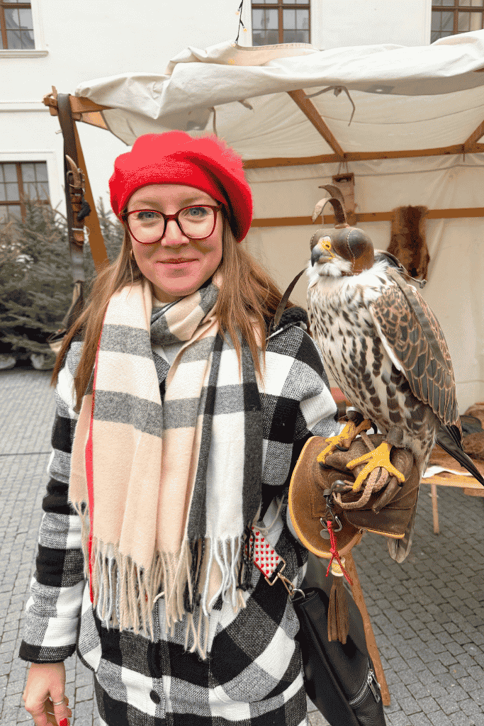Kate holding an osprey with a thick leather glove.