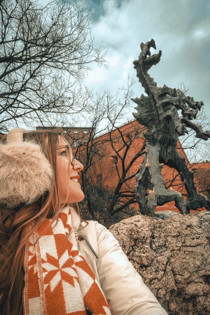 A selfie with the famous fire-breathing Wawel Dragon statue at the base of Wawel Hill in Krakow, Poland.