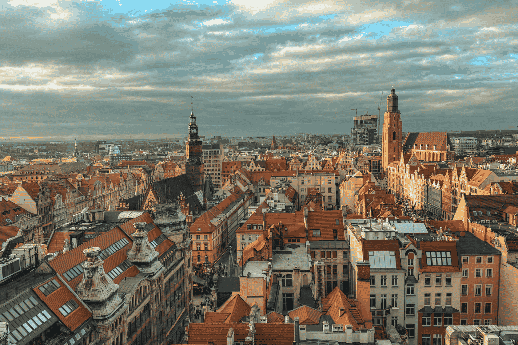 Panoramic view over Wroclaw Old Town with its colorful rooftops, historic churches, and city skyline.