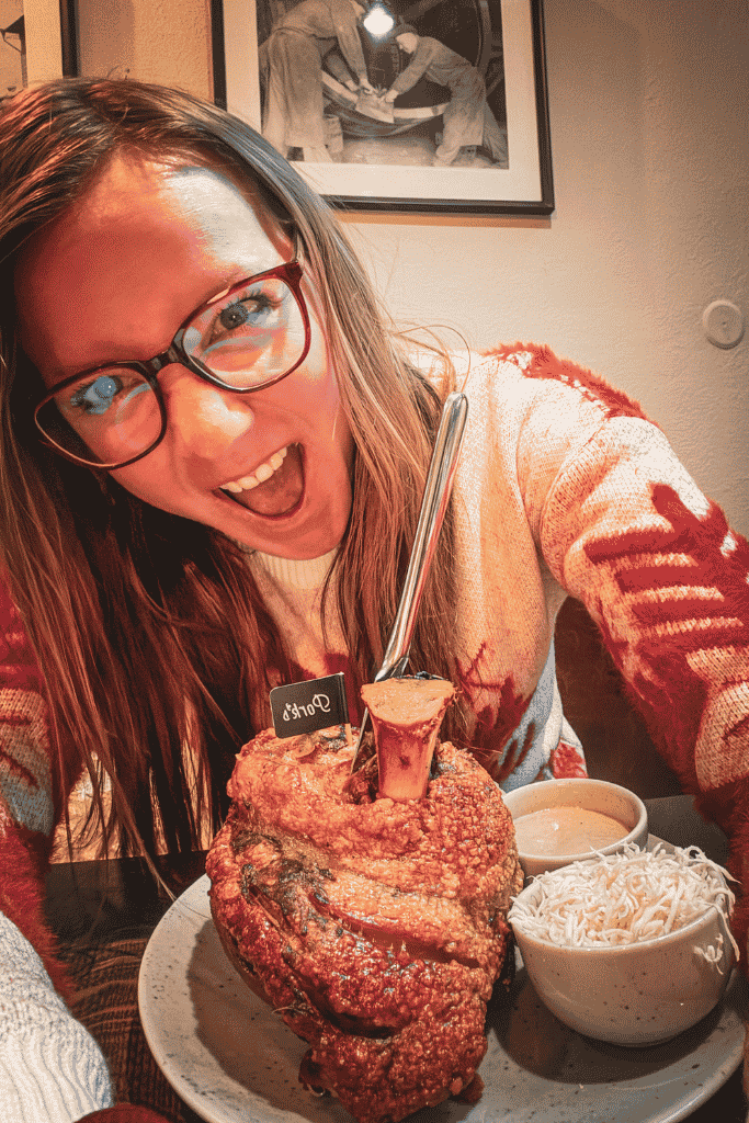 Tackling an enormous crispy Czech pork knuckle.