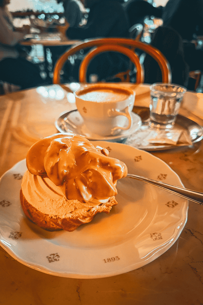 Coffee and a decadent pastry at Café Savoy—an essential Prague stop for anyone with a sweet tooth.