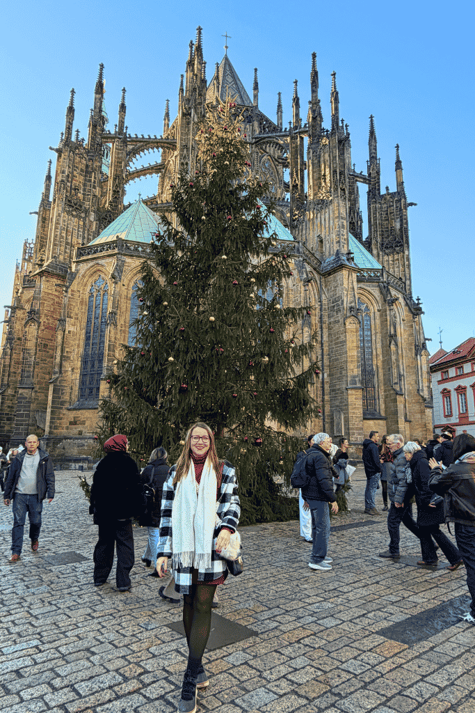 Christmas at Prague Castle, with a towering Christmas tree set against the magnificent Gothic architecture of St. Vitus Cathedral.