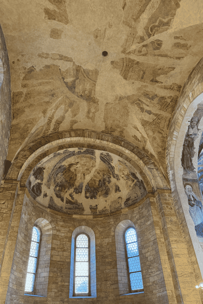 Inside St. George’s Basilica at Prague Castle, where centuries-old frescoes and simple Romanesque architecture offer a fascinating contrast to the grandeur of nearby St. Vitus Cathedral.