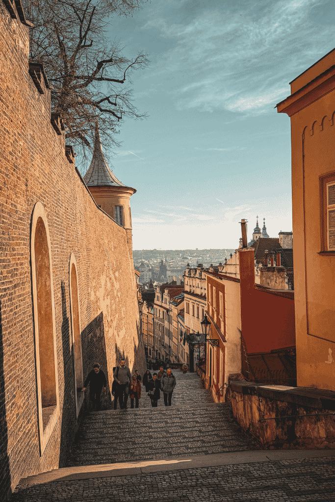 The steep cobblestone steps descending from Prague Castle offer a beautiful view over the city’s red rooftops and historic Lesser Town.