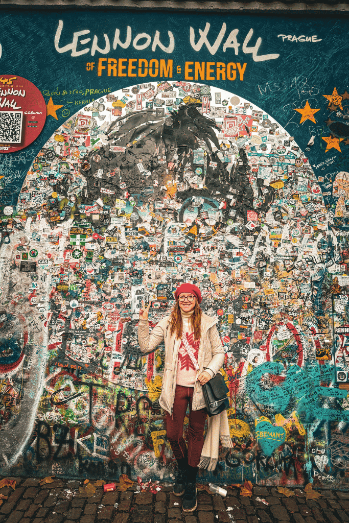 Standing at Prague’s colorful Lennon Wall, a constantly evolving symbol of peace, freedom, and creative expression in the heart of the city.