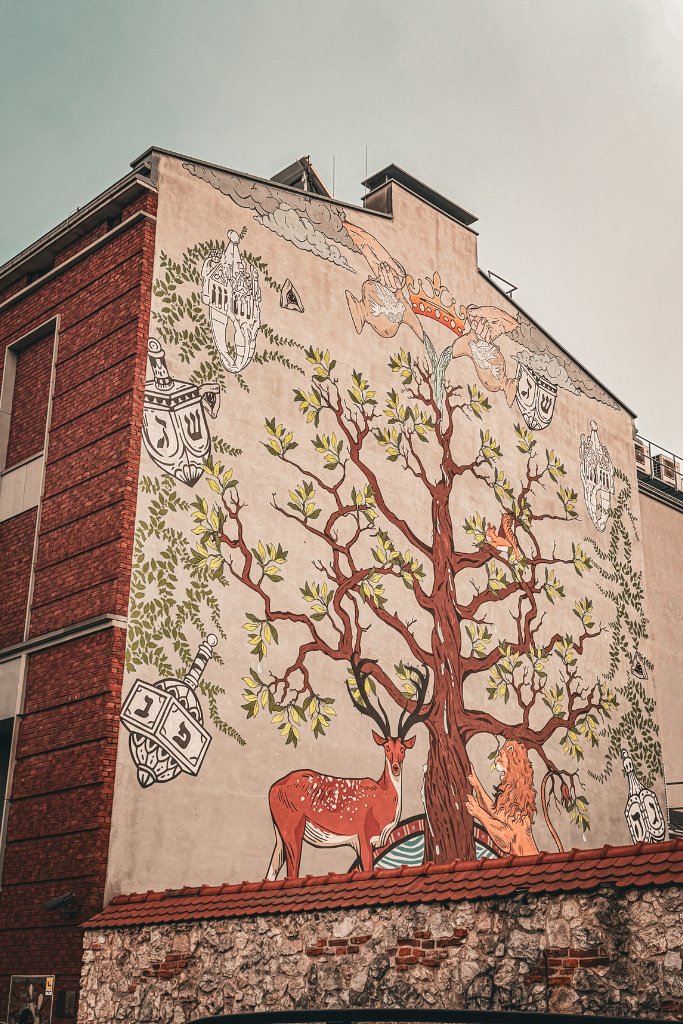 Colorful mural covering a building in Krakow’s historic Kazimierz district.