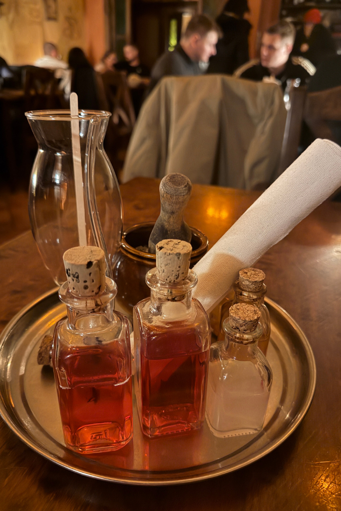 Small potion bottles used to create the interactive Love Potion drink at Tawerna Wilczy Dół in Krakow.