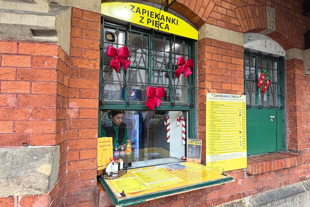 Zapiekanki food stall decorated for Christmas at Plac Nowy in Krakow’s Kazimierz district.