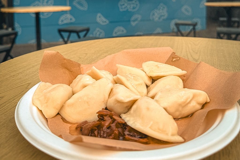 Plate of traditional Polish pierogi from a food truck at Judah Food Market in Krakow.