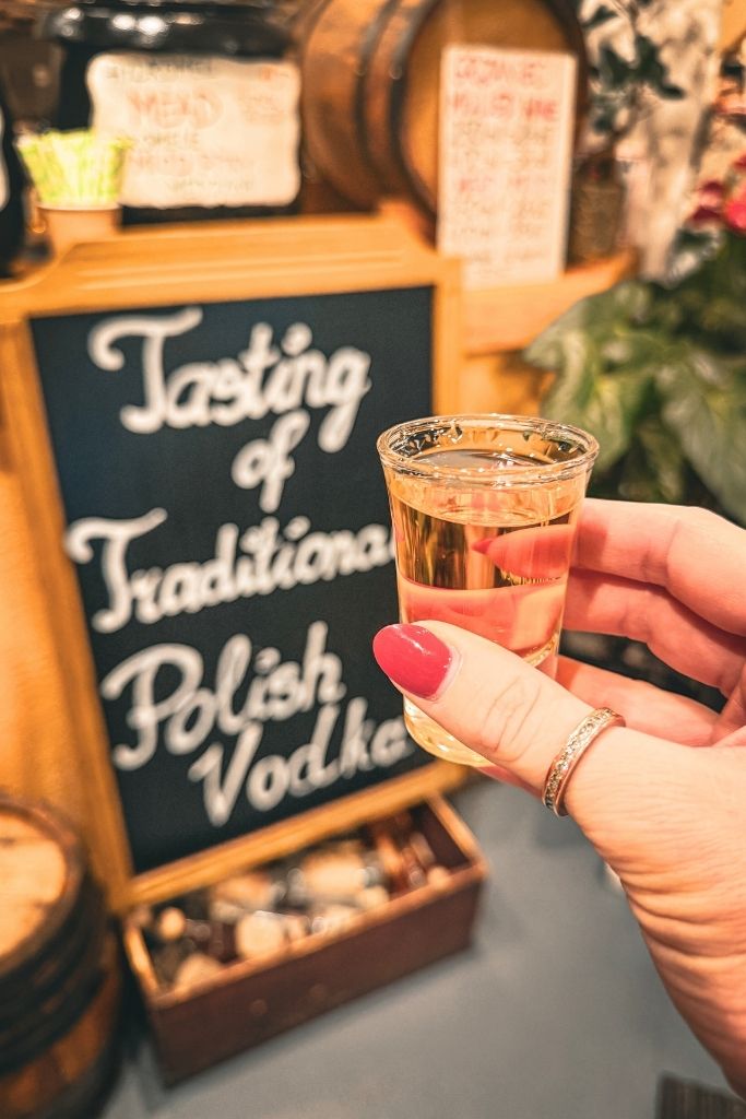 Sampling traditional Polish vodka during a food tour in Krakow
