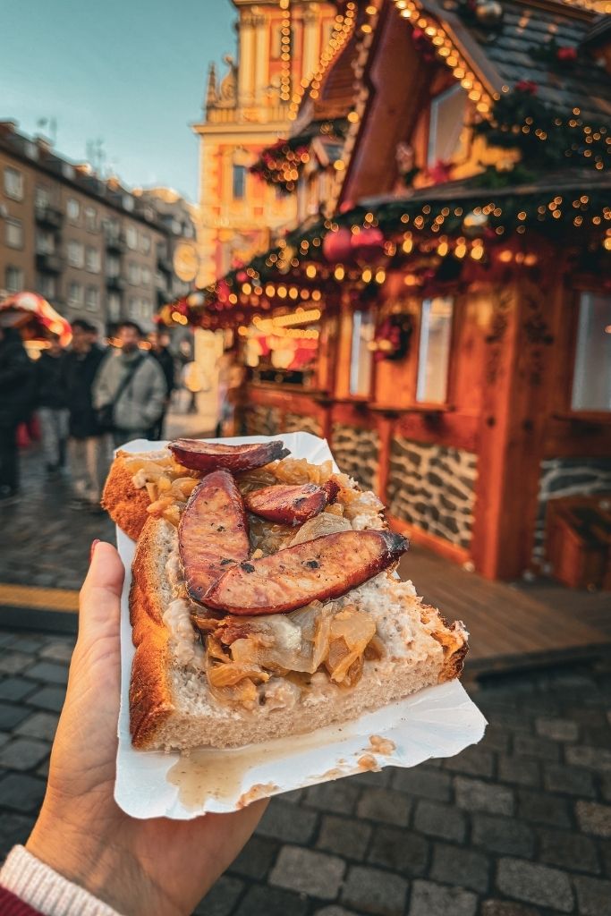 Polish sausage and sauerkraut served on bread at the Wroclaw Christmas Market.