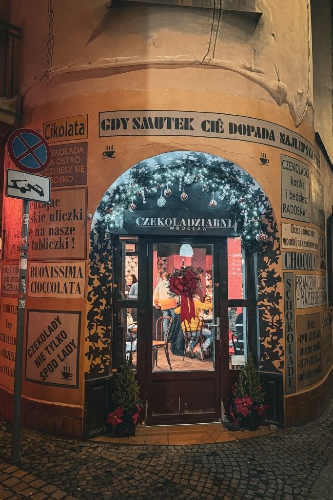 Christmas-decorated entrance to Czekoladziarnia chocolate cafe in Wroclaw, Poland.
