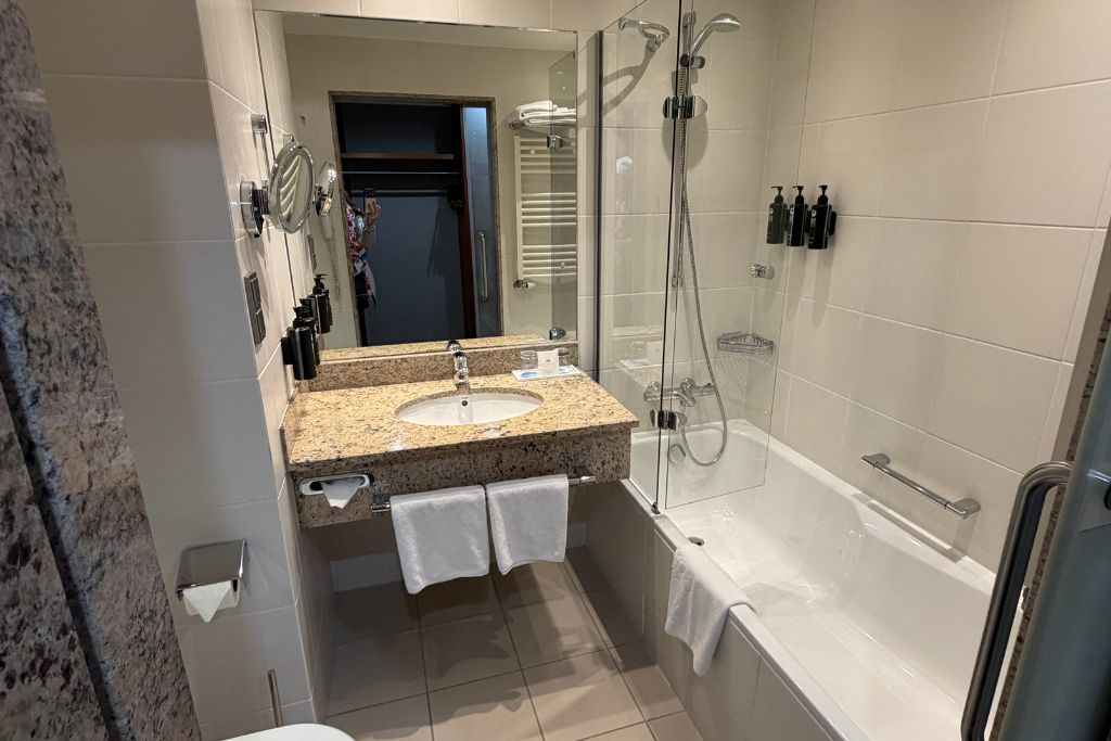 Modern bathroom with bathtub and shower at Wyndham Wroclaw Old Town hotel.