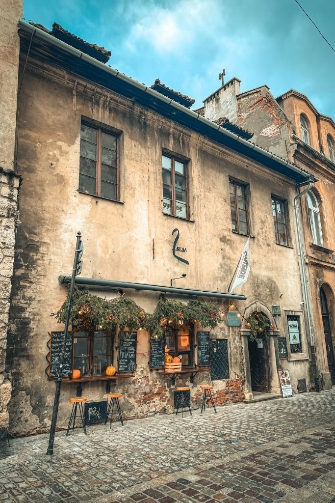 Charming historic building with a cozy café along the cobblestone streets of Krakow’s Kazimierz district.